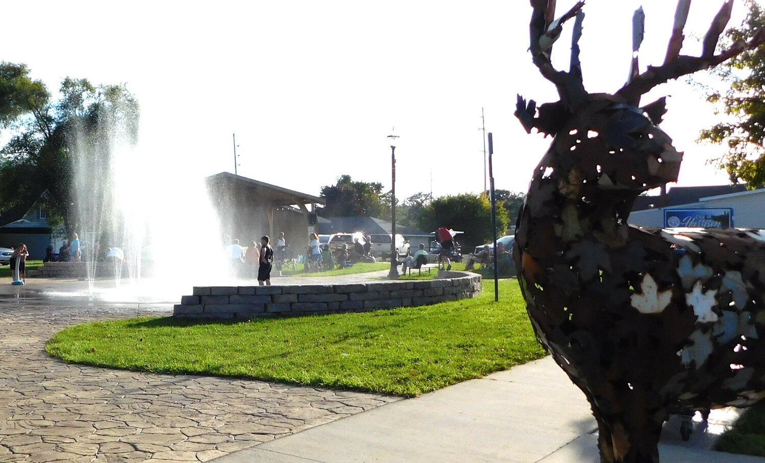 As always, kids make the most of the splash pad while the grups enjoy the Sept. 1 Friday Night Delight concert.
